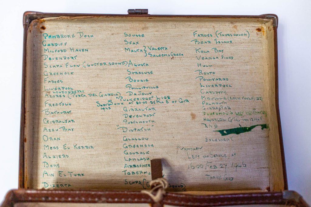 Suitcase belonging to Morris with the places he went during his Royal Navy service